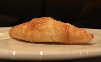 Croissant on plate photo