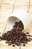 White coffee cup with coffee beans photo