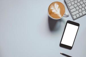 Top view of mockup smart phone and latte photo