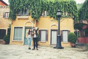 Happy couple walking in an urban area photo