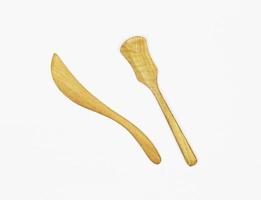 Wooden utensils on white photo