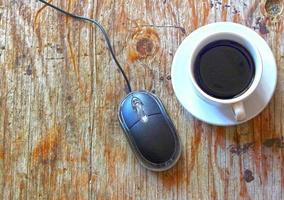 Computer mouse and coffee photo