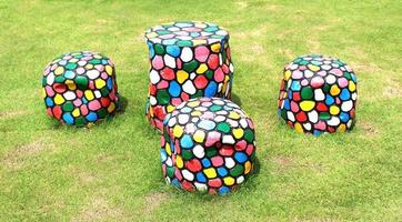 Set of table and chairs on green grass photo