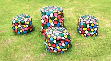 Set of table and chairs on green grass photo