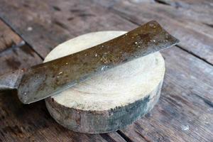 Axe on wood slice photo