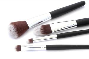 Makeup brushes on white photo