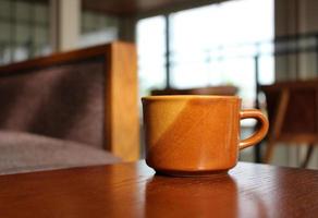 Coffee mug on table photo
