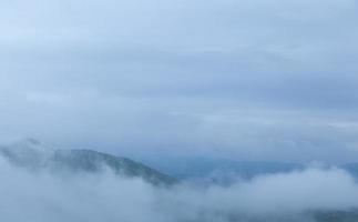 Fog covered mountains photo