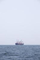 Large cargo ship on the sea photo