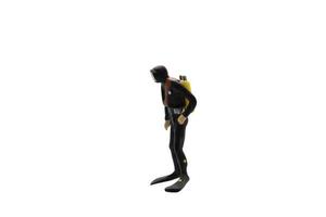 Miniature figurine of a scuba diver isolated on white background photo