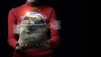Woman holding bag with earth in it