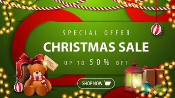 Special offer, Christmas sale, up to 50 off, green bright horizontal modern web banner with button, large red circles, antique lamp and present with Teddy bear vector
