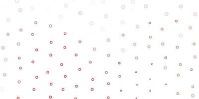 Light red, yellow vector background with spots.