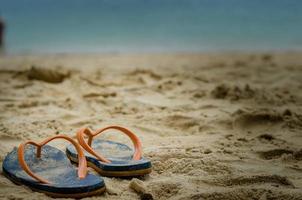 Flip flops in the sand photo