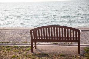 Single bench at the sea photo