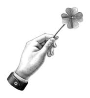 Hand holding clover leaf drawing vintage style black and white art isolated on white background