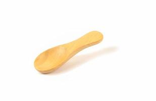 Wooden scoop on white photo