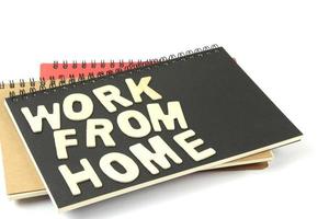 Work from home letters on notebook photo