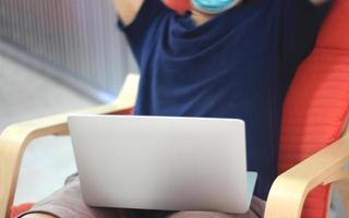 Person working while wearing face mask photo