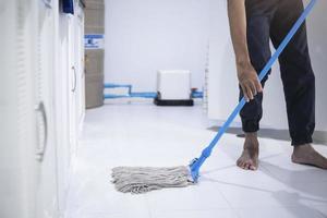 Person mopping the floor photo