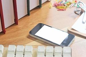 Phone on desk mock-up photo