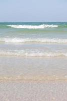 Ocean waves crashing on the beach photo