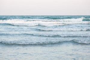 Ocean waves crashing on the beach photo