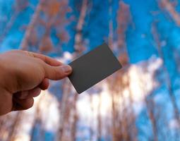 Person holding a grey photo card