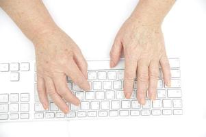 Person typing on keyboard photo