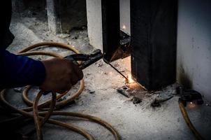 Person welding metal photo