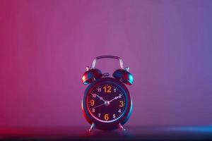 Alarm clock on colorful background photo