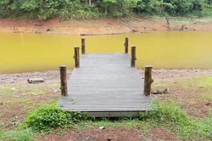 Wooden pier at the river photo