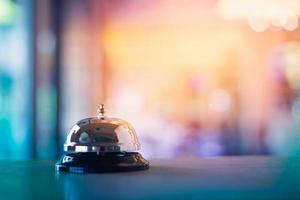 Service bell on colorful bokeh background photo