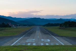 Airport runway at sunset photo