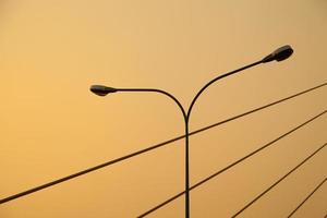 Light pole and ropes of the bridge photo