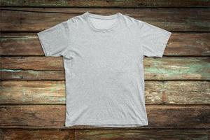White t-shirt on wood background for mockup template