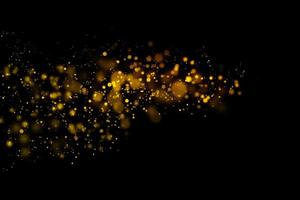 Blurred gold circles on black background photo