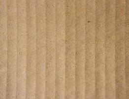 Close-up de papel marrón estriado para textura o fondo foto