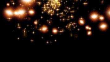 Gold flying glitter star over black background video