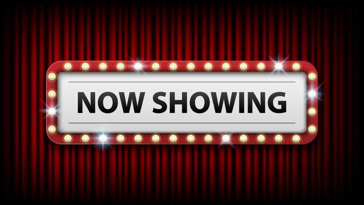 Now showing with electric bulbs frame on red curtain background