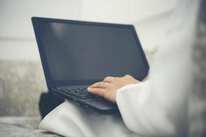 Doctor in hospital using a digital tablet while taking a rest photo