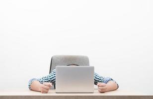 Portrait of young businessman sitting in workplace photo