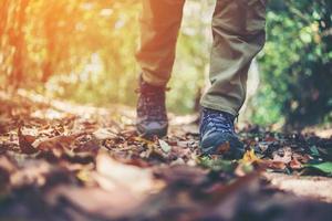 Close-up of hiker's feet walking on a mountain path photo