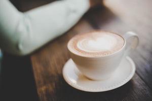 Hot art latte coffee with heart shape