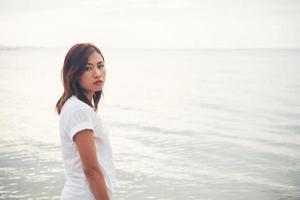 Young beautiful woman at the beach photo