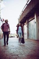 Portrait of a hipster couple walking in the street photo