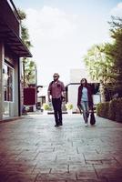 Portrait of a hipster couple walking in the street photo