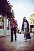 Portrait of a hipster couple walking in the street photo