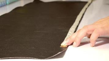 Leather tailor is working handmade product video
