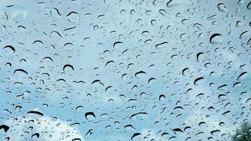 Rain drop over a car window video